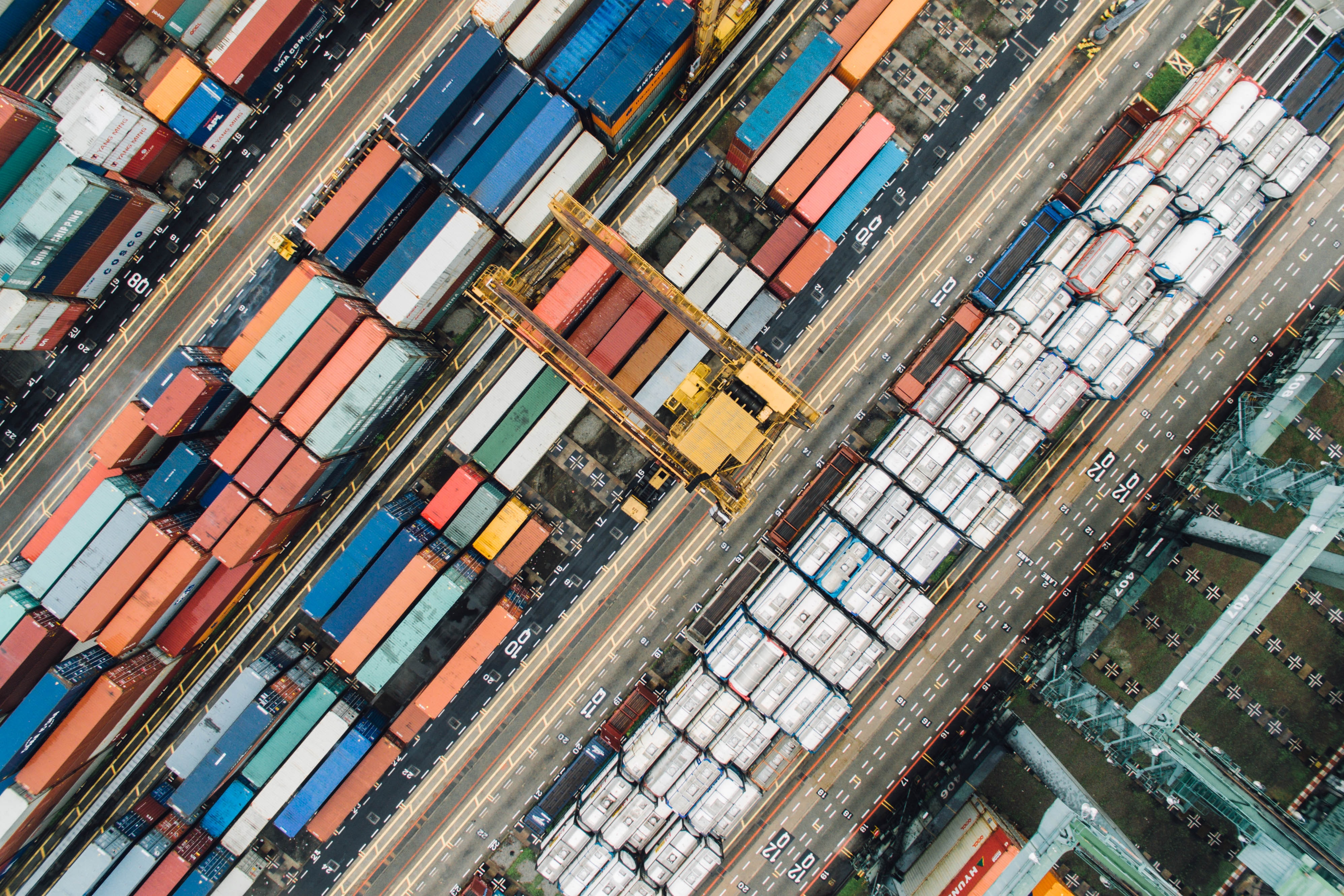 Birds eye view over different sized and colored shipping containers